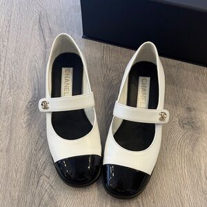 CHANEL Two-Tone White Leather Mary Jane Flats with Black Patent Cap